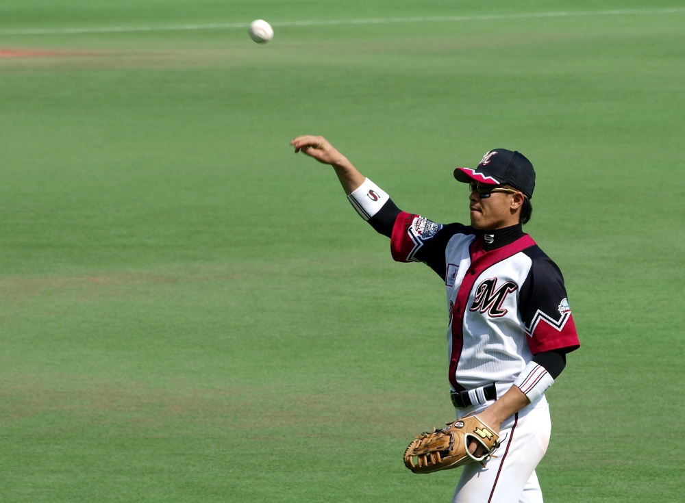 Saburo throws one into the crowd after a nice play in right