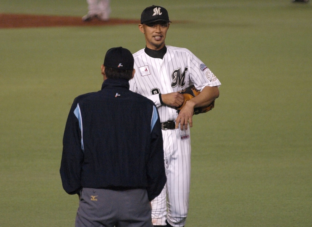 Fukuura shares a joke with the ump