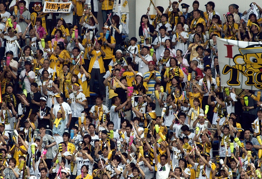 Hanshin fans using noisemakers, of course