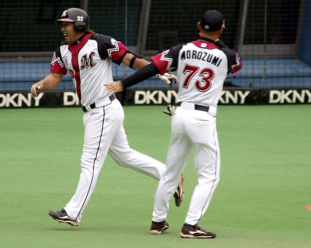 Morozumi gives Sato a pat for his homer to right